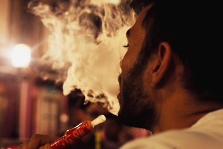 A shisha smoker at a popular café, captured by Rachael Hyde, 